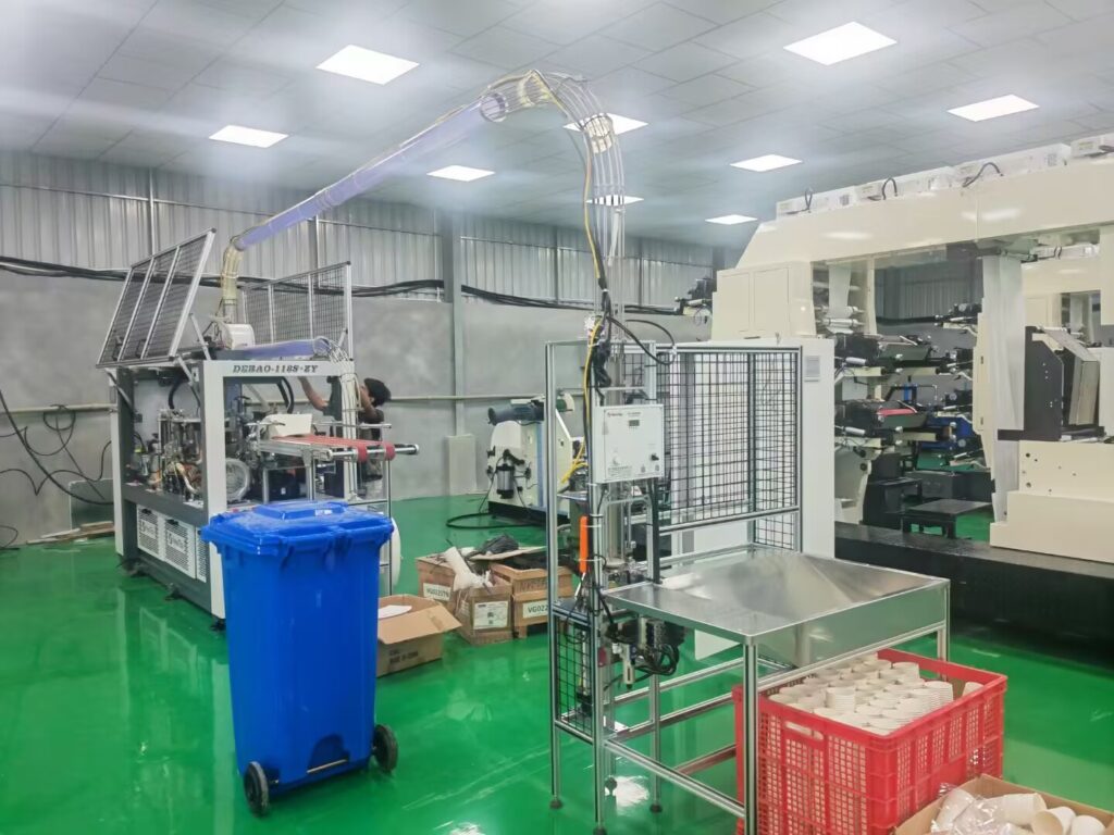 Paper cup forming machines operating at Artcool Cambodia factory